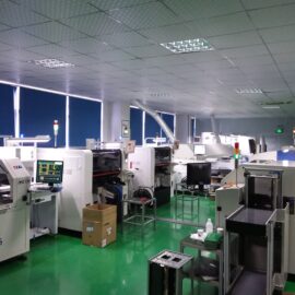 Factory floor with industrial machines and equipment.