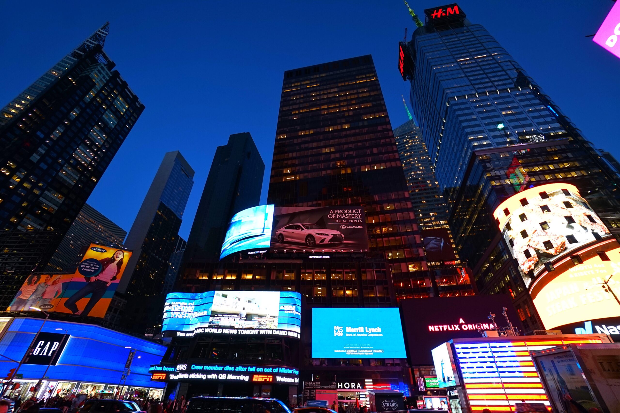 Times Square at night with bright billboards