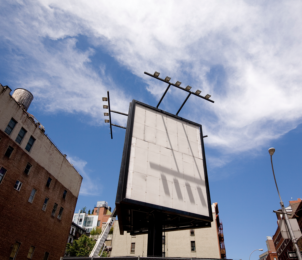 Cityscape featuring tall empty billboard